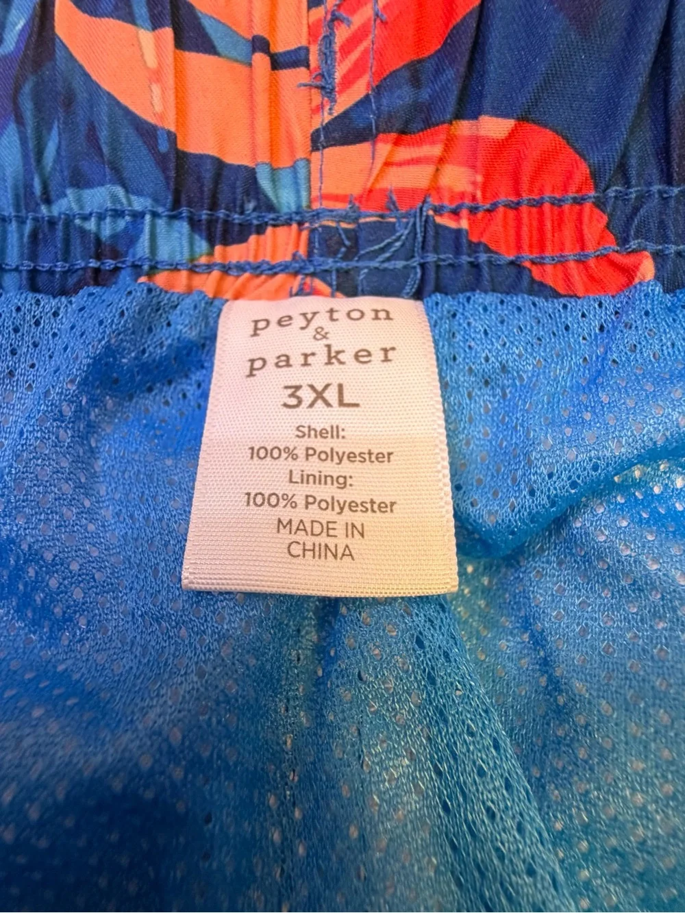 Peyton & Parker Navy Tropical Leaf Print Swim Trunks with Coral Accents